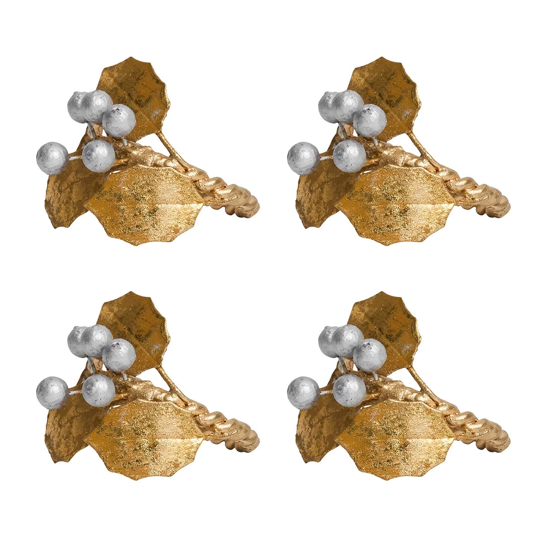 Set of four Gold Holly Napkin Rings featuring textured gold holly leaves, silver berries and twisted gold rings