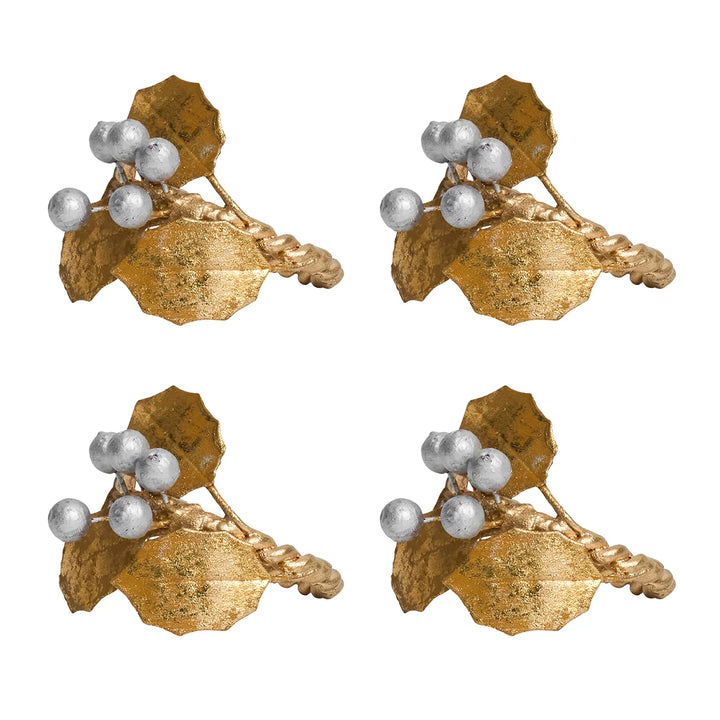 Set of four Gold Holly Napkin Rings featuring textured gold holly leaves, silver berries and twisted gold rings