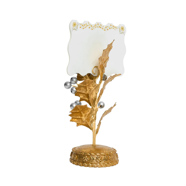 Back view of gold holly and silver berry place card holder showing the metal card loop, detailed leaves, berries, and decorative gold base.