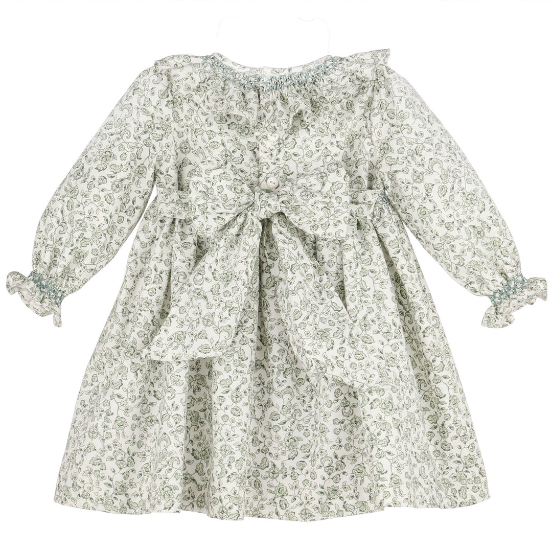 Back view of Green Heirloom Floral Smocked Dress featuring button closure, sash bow, and green floral print