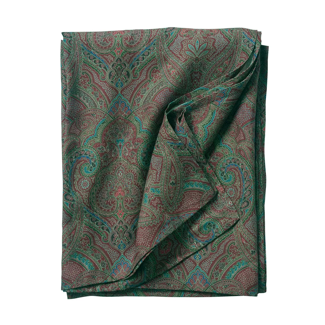 Folded green paisley tablecloth featuring an intricate multicolor pattern with burgundy, blue, brown and botanical-inspired details.