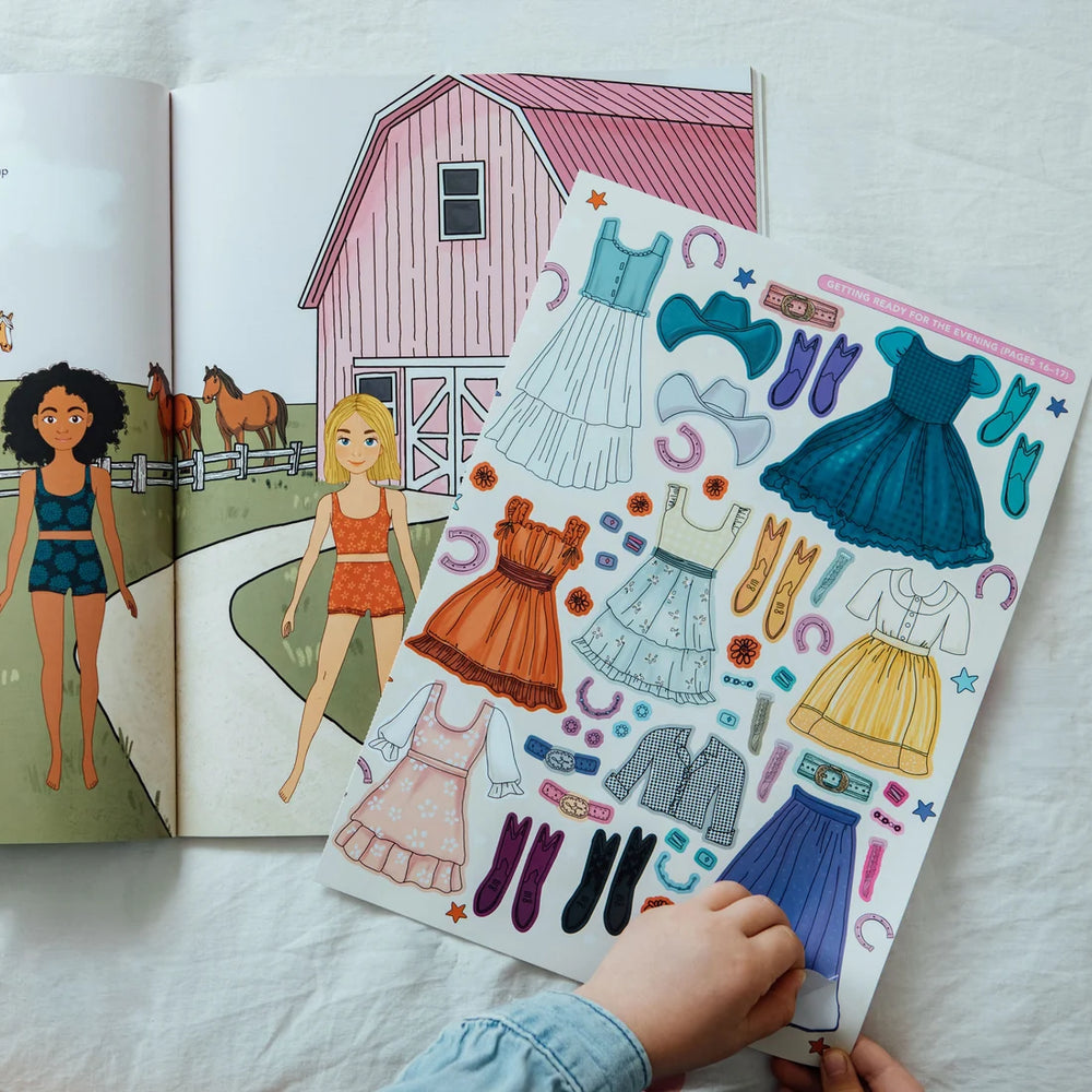 Child playing with My Fancy Sticker Storybook Horses & Ponies, featuring colorful dress-up stickers, cowboy hats, boots, and a pink horse stable.