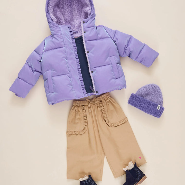 Girls Lavender Ruffle Pete Puffer styled with tan pants, purple beanie, and boots