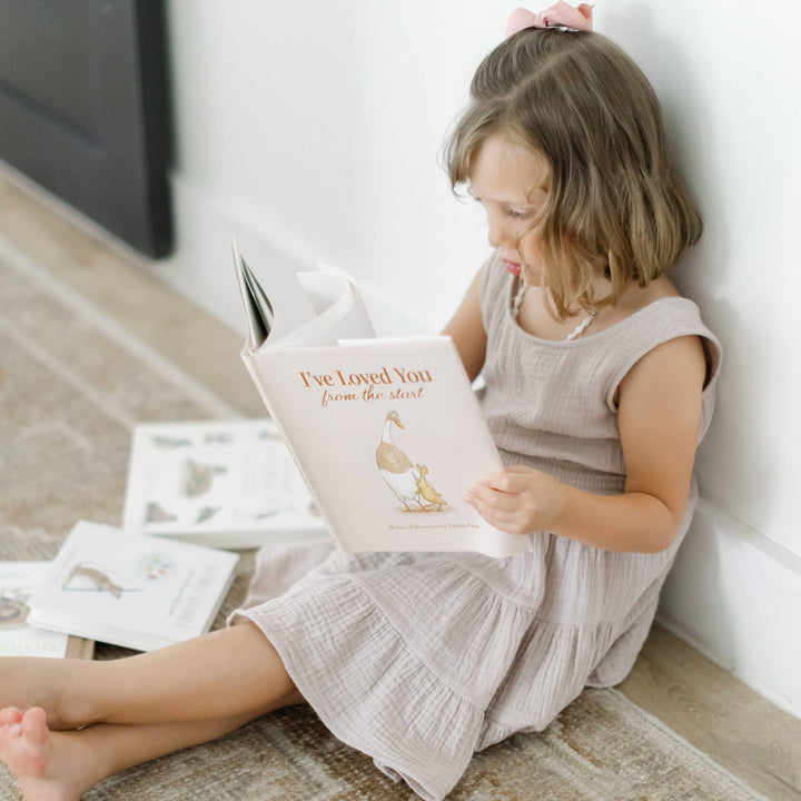Young child reading I&