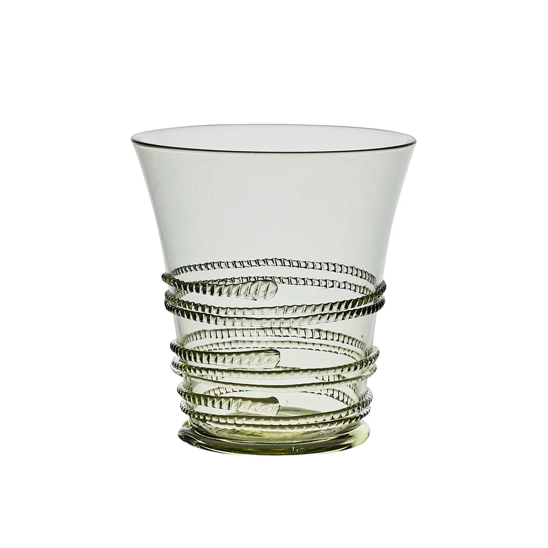 Juliska green glass tumbler featuring a flared silhouette with signature wrapped glass thread detailing and a subtle green base.