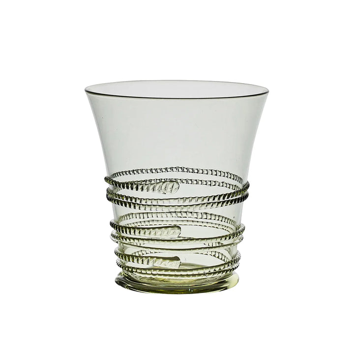 Juliska green glass tumbler featuring a flared silhouette with signature wrapped glass thread detailing and a subtle green base.
