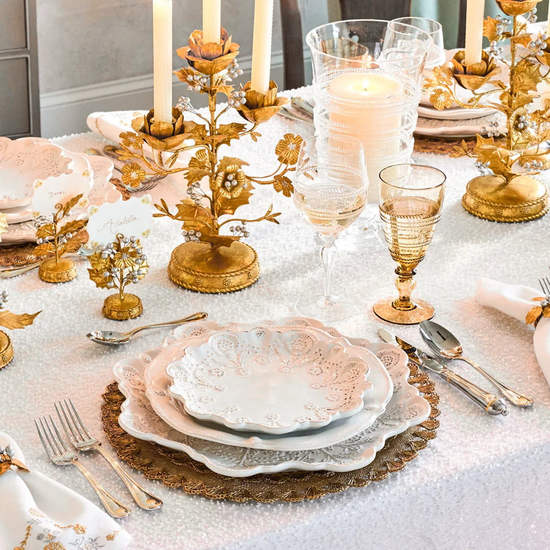 Juliska Holly place cards styled on an elegant table with gold floral accents, white dinnerware and candleholders