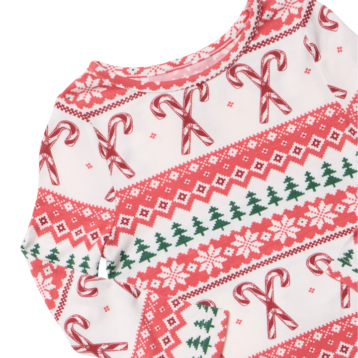 Close-up of Candy Cane Fair Isle bamboo pajamas featuring red candy canes, pink snowflakes, and green Christmas trees.