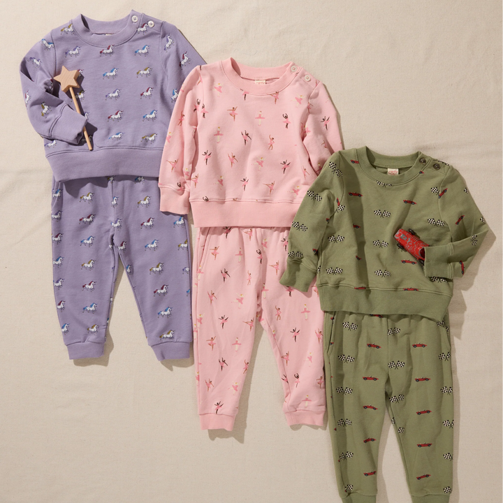 Kids printed sweatshirt and jogger sets featuring olive green race cars and checkered flags, pink ballerinas and purple unicorns.