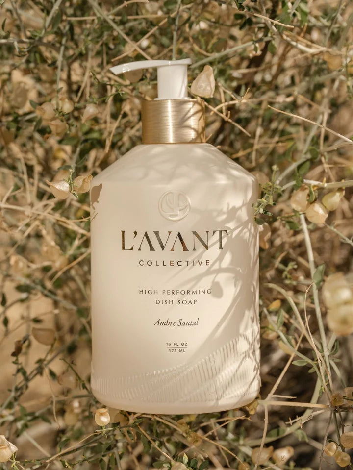 L’AVANT Collective Ambre Santal High Performing Dish Soap 16 oz bottle styled in a natural outdoor setting