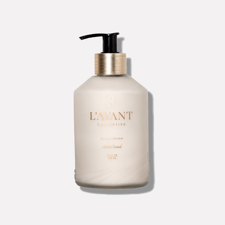 L’AVANT Collective Ambre Santal Hand Lotion 10 oz in an elegant cream bottle with gold accents and black pump
