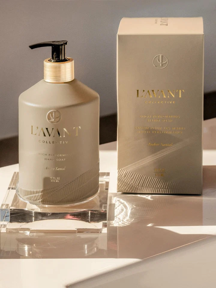 L’AVANT Ambre Santal High Performing Hand Soap 16 oz bottle displayed beside its coordinating luxury packaging