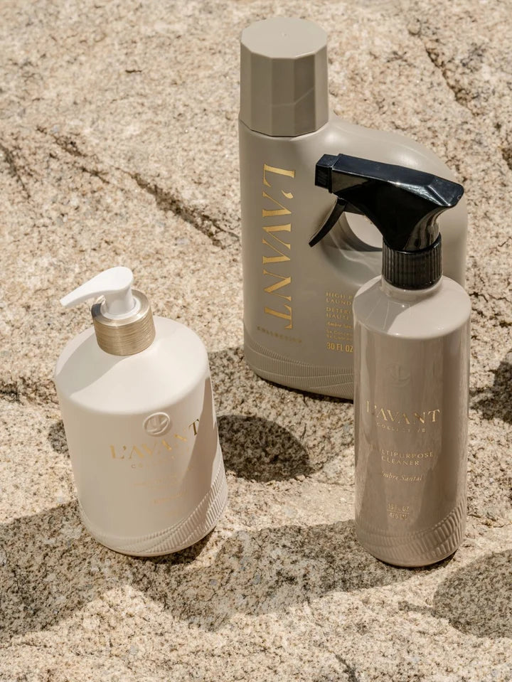 L’AVANT Ambre Santal luxury home cleaning collection featuring dish soap, multipurpose cleaner and laundry detergent