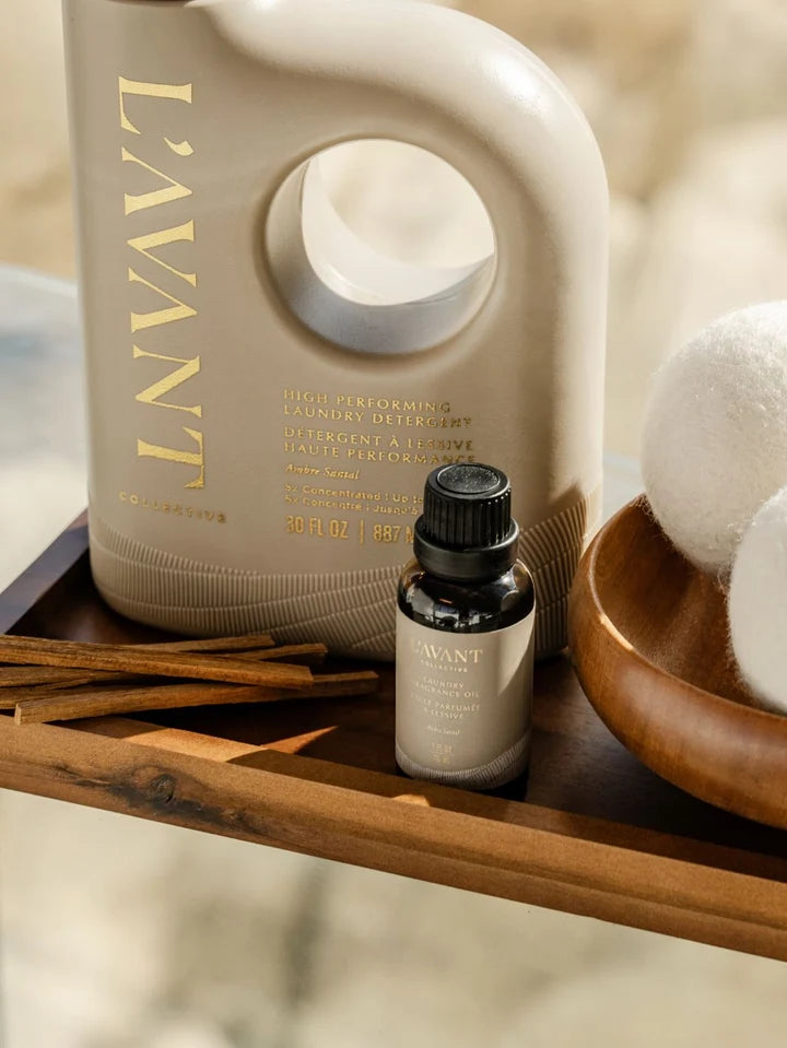 L’AVANT Collective Ambre Santal laundry detergent with laundry fragrance oil and wool dryer balls