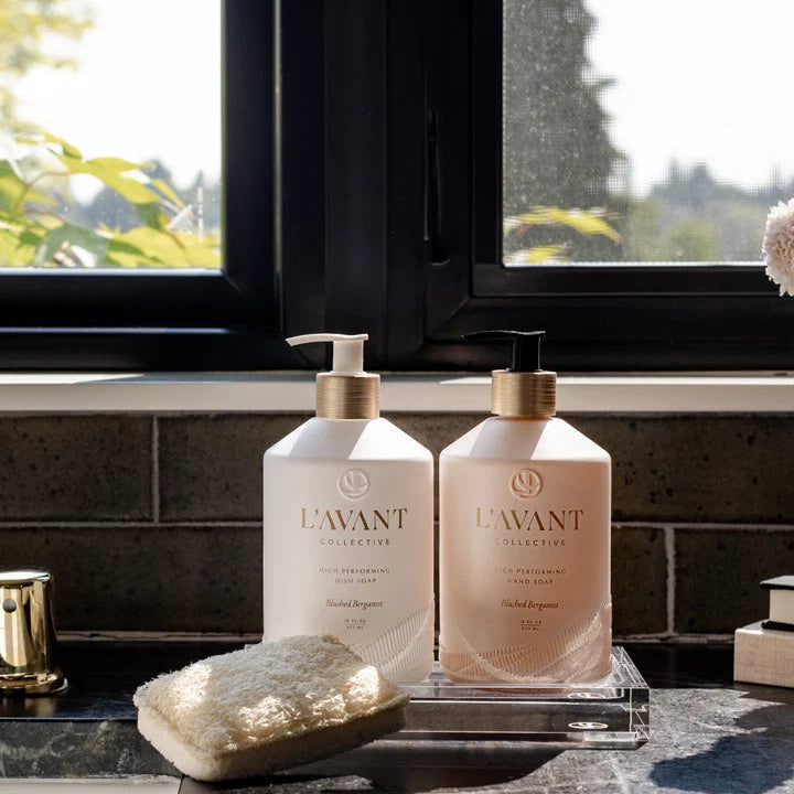 L’AVANT Blushed Bergamot dish soap and hand soap displayed together beside a modern kitchen sink