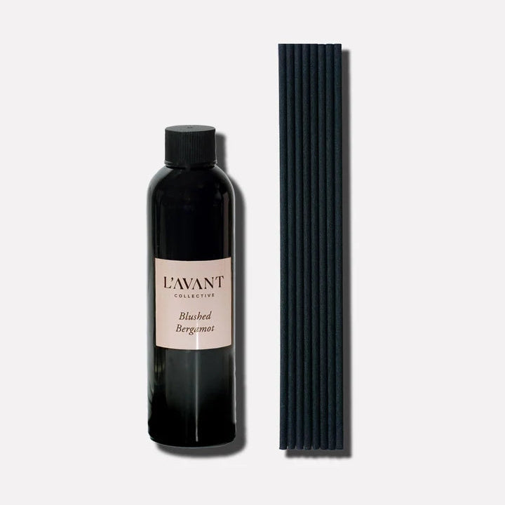 L’AVANT Collective Blushed Bergamot reed diffuser refill oil with black replacement diffuser reeds.