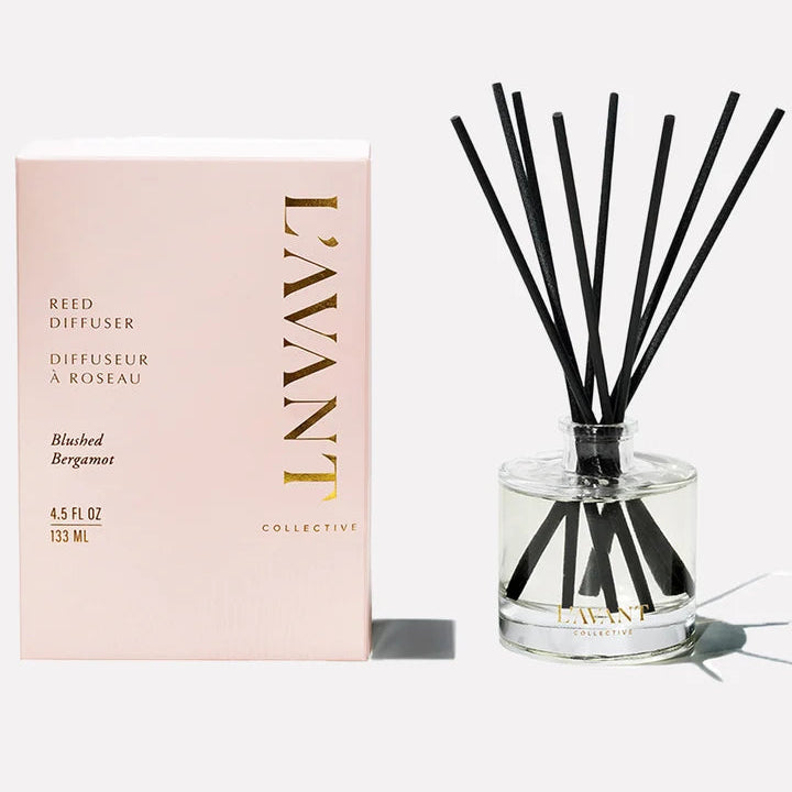 L’AVANT Collective Blushed Bergamot reed diffuser with black reeds and blush pink product packaging.