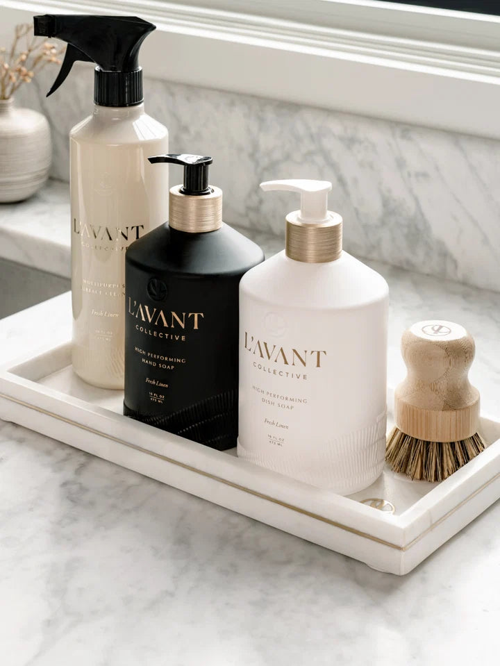 L’AVANT Fresh Linen dish soap, hand soap and multipurpose cleaner arranged on a white marble kitchen tray