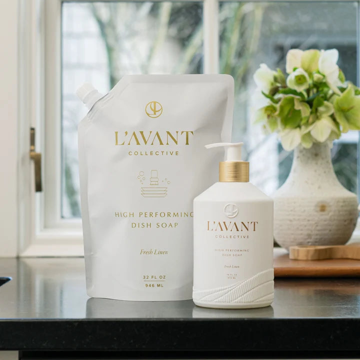 L’AVANT Fresh Linen High Performing Dish Soap 16 oz bottle with 32 oz refill pouch on a kitchen counter