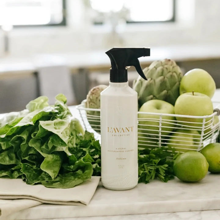 L’AVANT Fresh Linen Multipurpose Cleaner displayed in a kitchen beside fresh produce