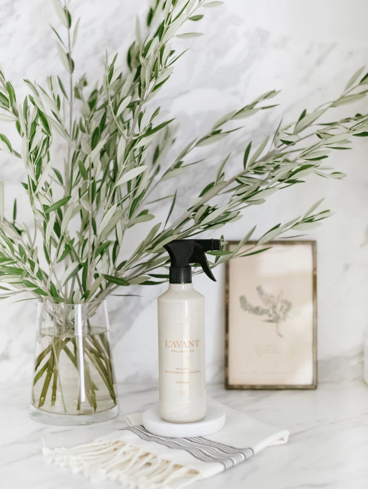 L’AVANT Fresh Linen Multipurpose Cleaner displayed on a kitchen countertop with greenery
