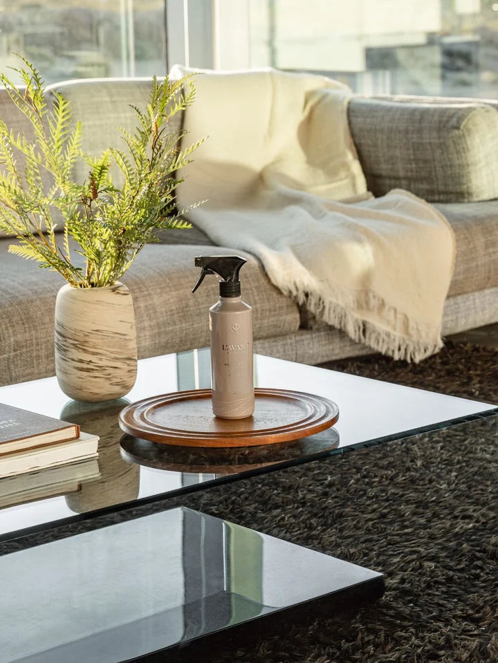 L’AVANT Multipurpose Cleaner displayed on a living room coffee table for everyday surface cleaning