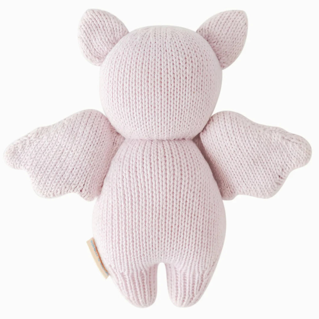 Back view of the lavender knitted baby bat stuffed animal with outstretched wings