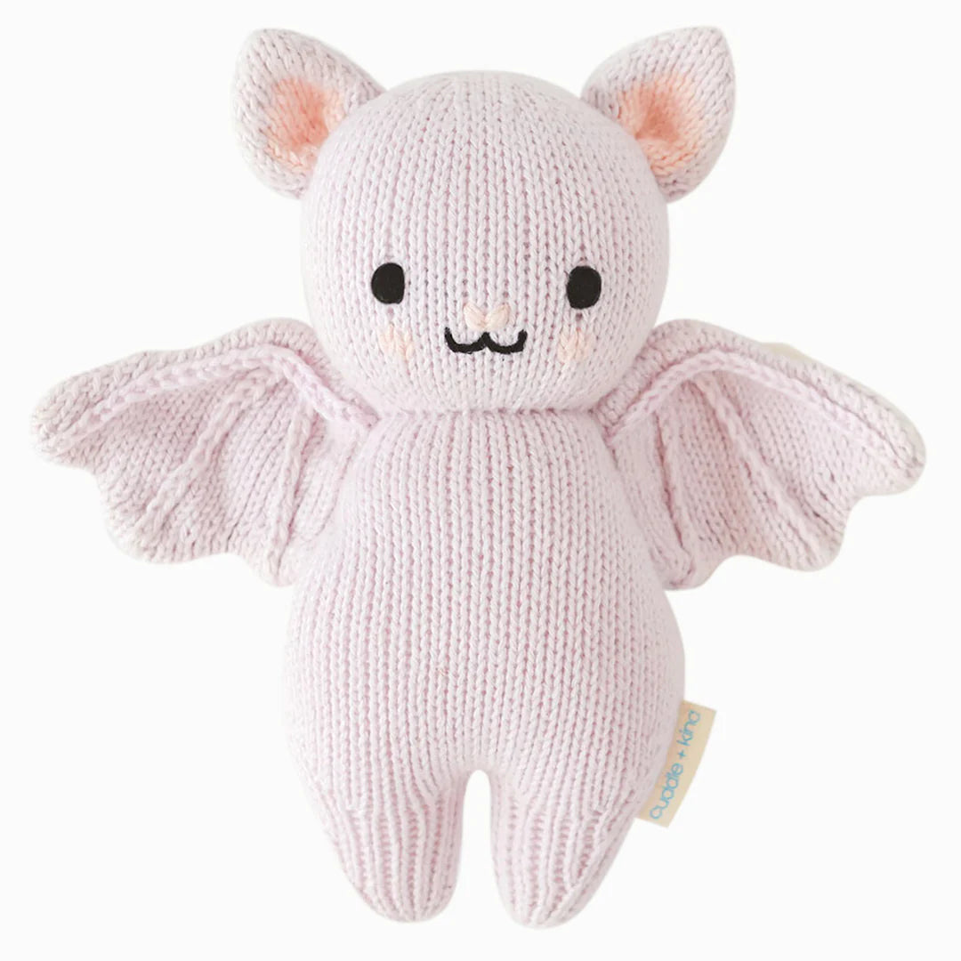 Lavender knitted baby bat stuffed animal with embroidered face and outstretched wings