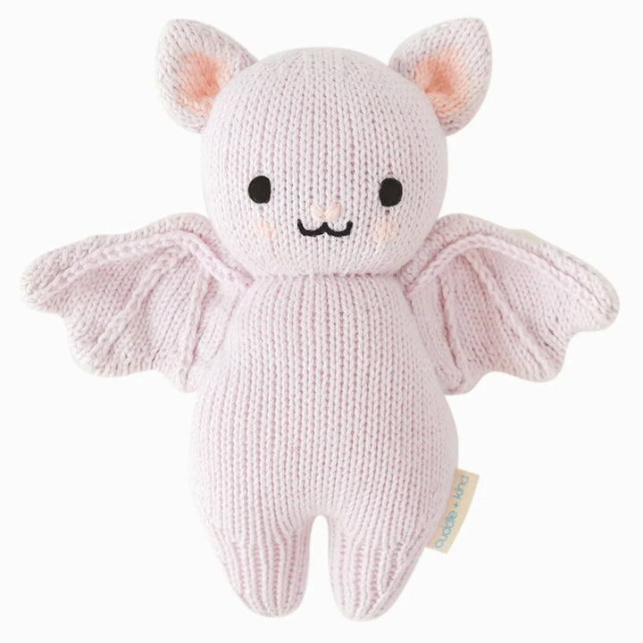 Lavender knitted baby bat stuffed animal with embroidered face and outstretched wings