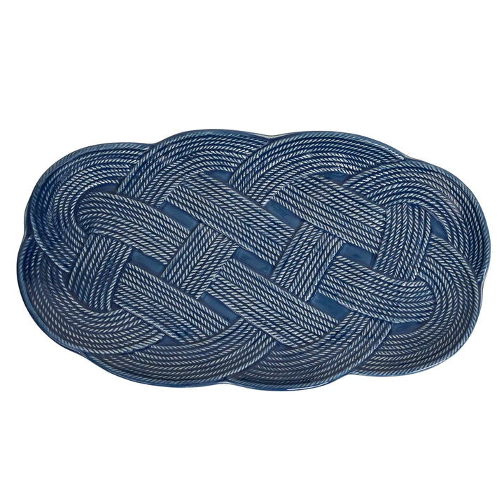 Le Panier Mystic Knot 15-inch Hostess Tray in Denim featuring woven basketweave detailing and a blue mystic knot accent.