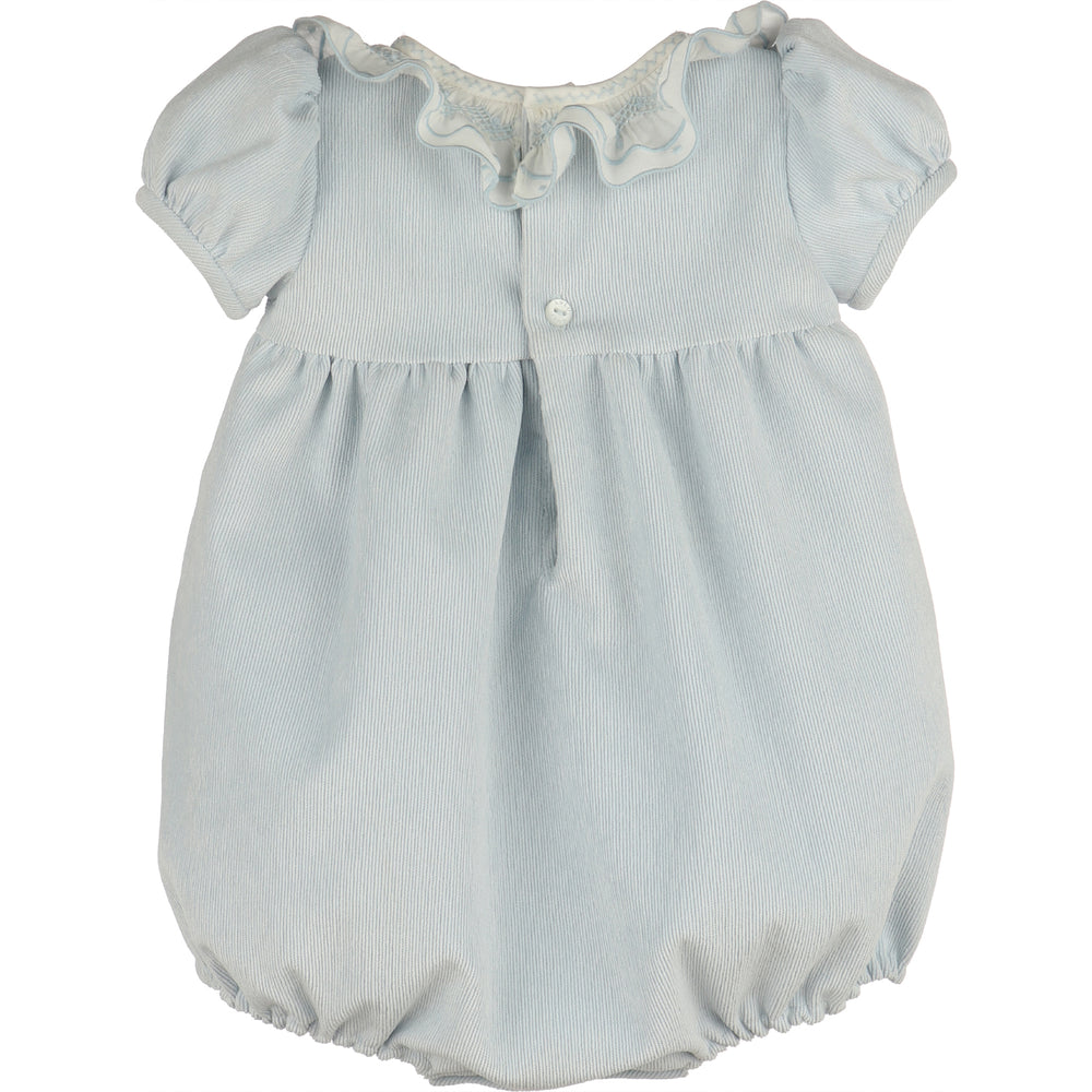 Back view of light blue corduroy baby girl bubble with white ruffle collar, puff sleeves, button-back closure, gathered waist, and elastic leg openings.