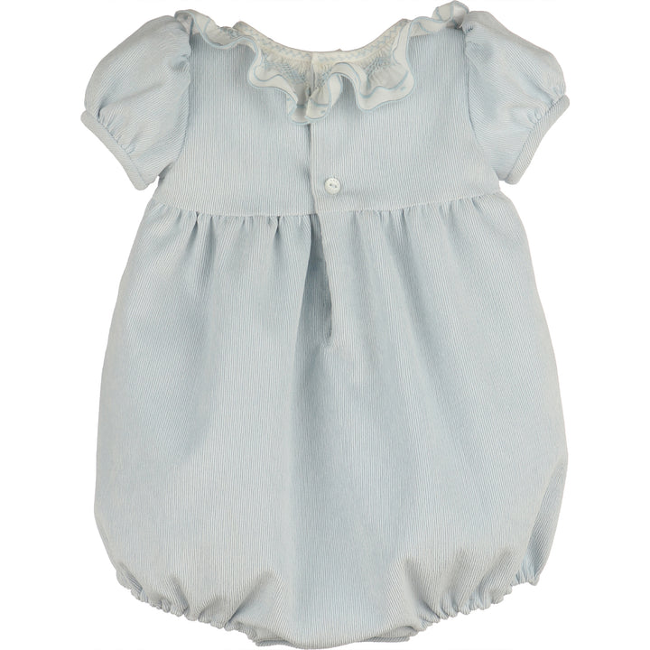 Back view of light blue corduroy baby girl bubble with white ruffle collar, puff sleeves, button-back closure, gathered waist, and elastic leg openings.