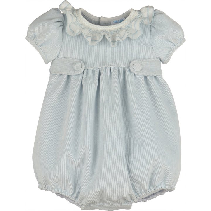 Front view of light blue corduroy baby girl bubble with white smocked ruffle collar, puff sleeves, covered button tabs, and elastic leg openings.