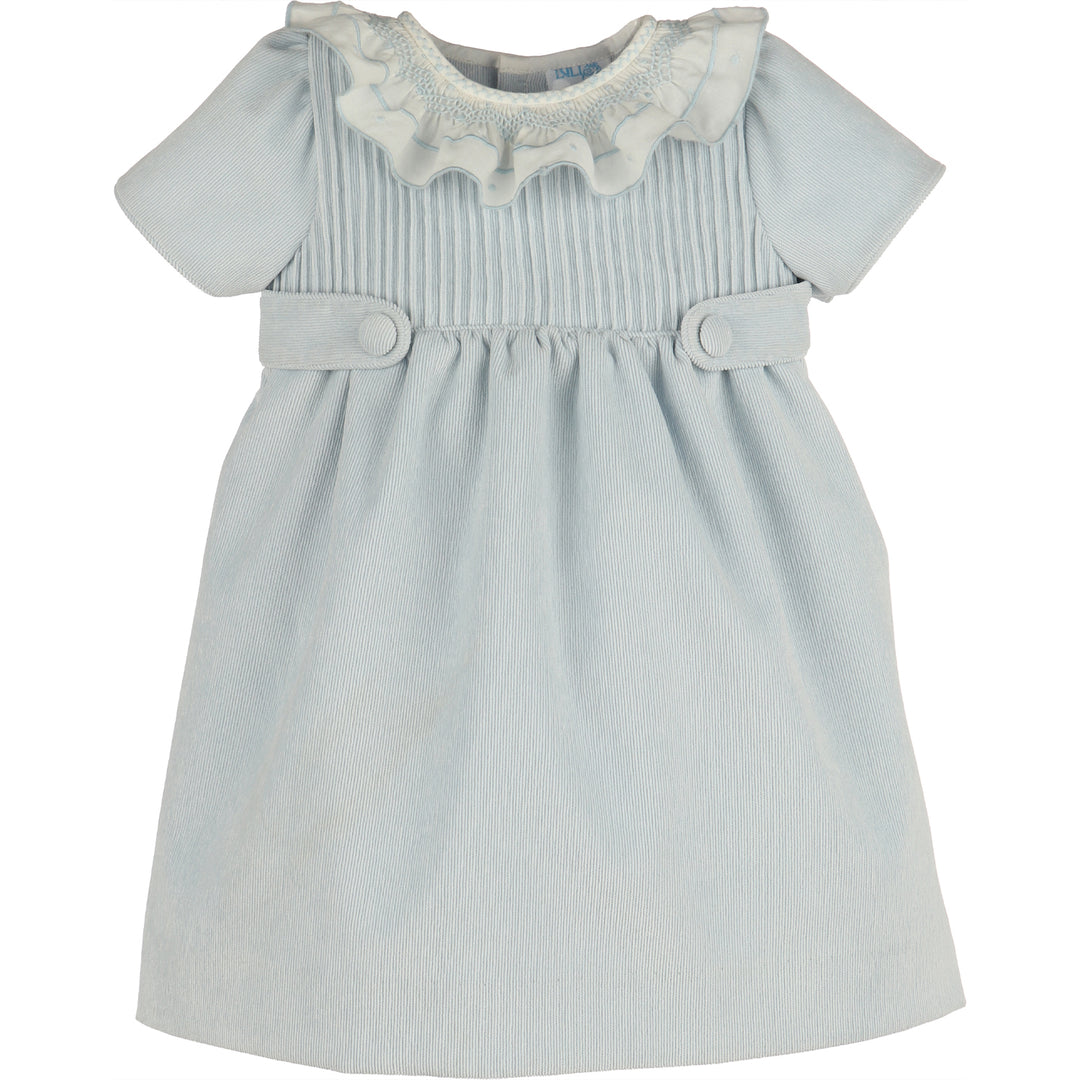Front view of light blue corduroy girls dress with white smocked ruffle collar, short sleeves, gathered skirt, and covered button waist tabs.