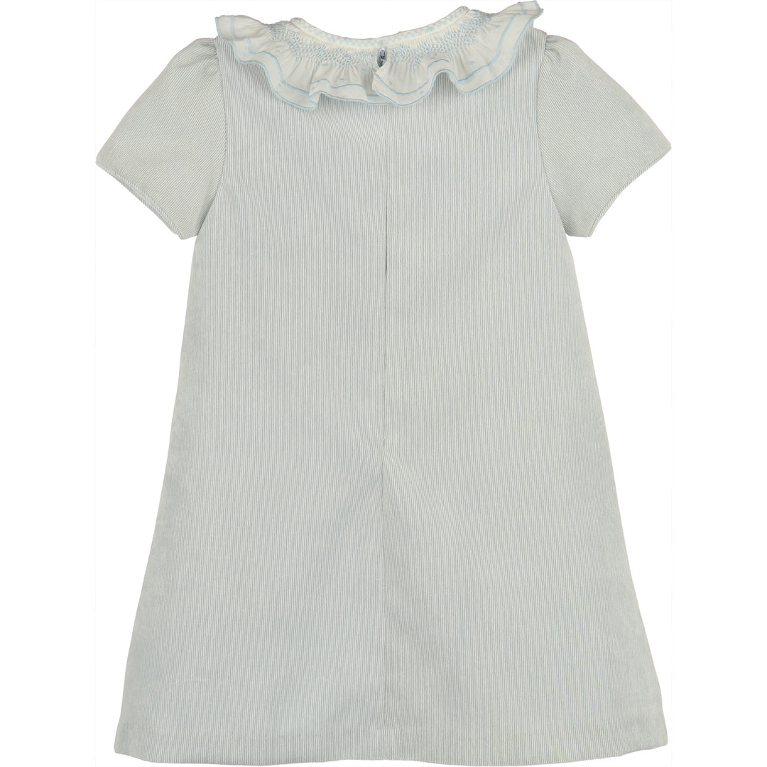 Back view of light blue corduroy A-line girls dress with white ruffled collar, blue embroidered trim, and short sleeves.