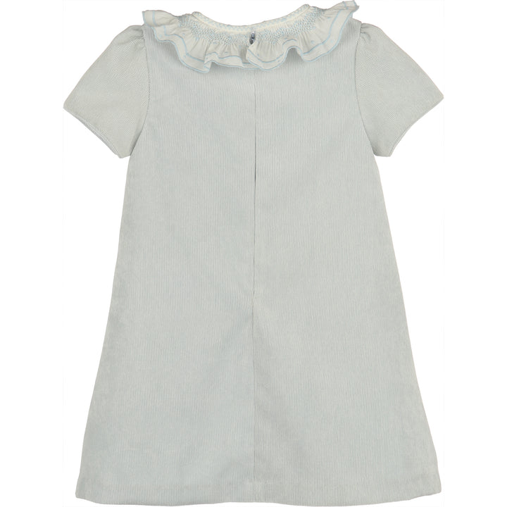 Back view of light blue corduroy A-line girls dress with white ruffled collar, blue embroidered trim, and short sleeves.