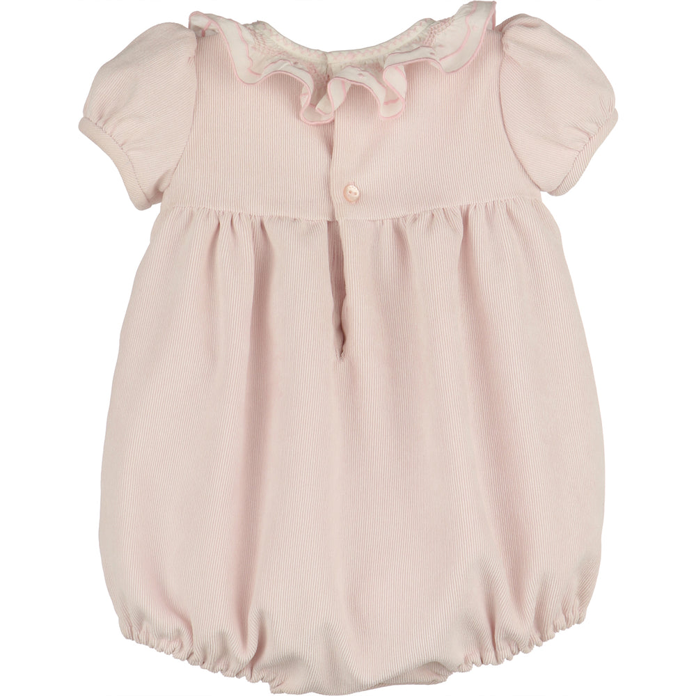 Back view of light pink corduroy baby girl bubble with white ruffle collar, puff sleeves, button-back closure, gathered waist, and elastic leg openings.