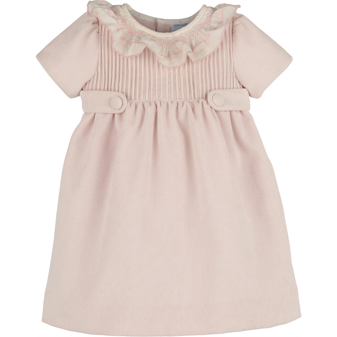 Front view of light pink corduroy girls dress with white smocked ruffle collar, short sleeves, gathered skirt, and covered button waist tabs.