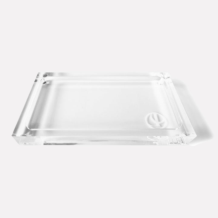 Medium clear lucite rectangular tray featuring transparent acrylic construction and a recessed center for organizing countertop essentials.