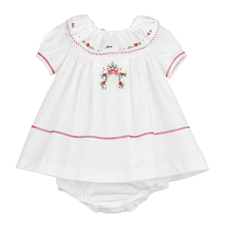 Merrymaker white Christmas dress with red and green holiday embroidery, ruffled neckline, puff sleeves, and coordinating bloomer.