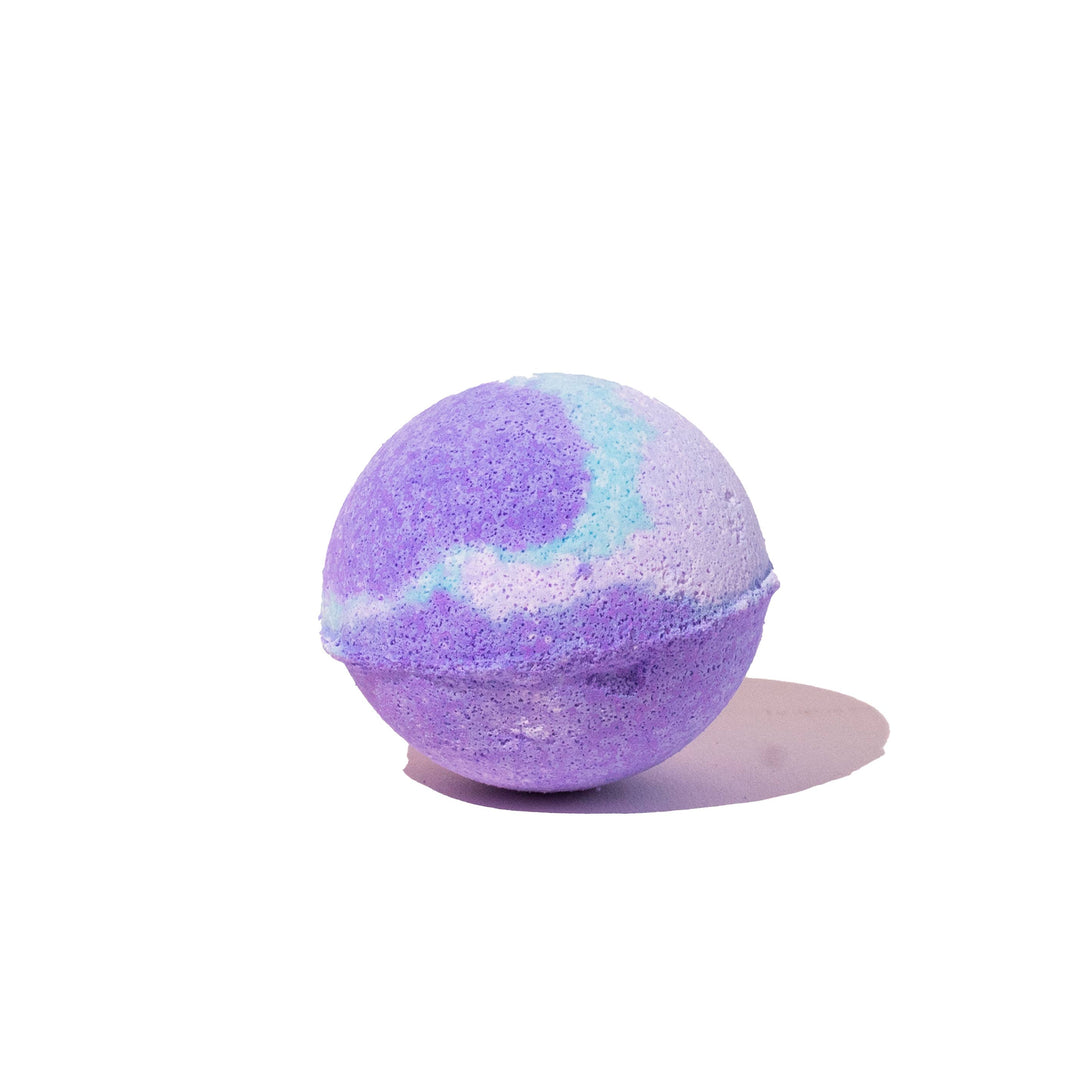 Musee Lavender Haze surprise bath balm unwrapped, showing its coloring of purples and blues. 