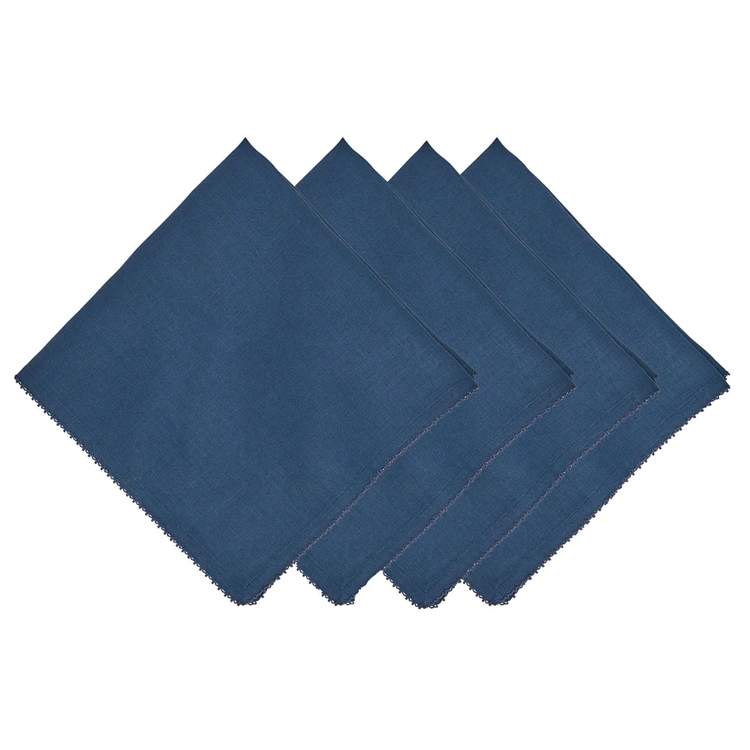 Set of four navy blue linen napkins featuring delicate tonal crochet edging and a classic woven texture