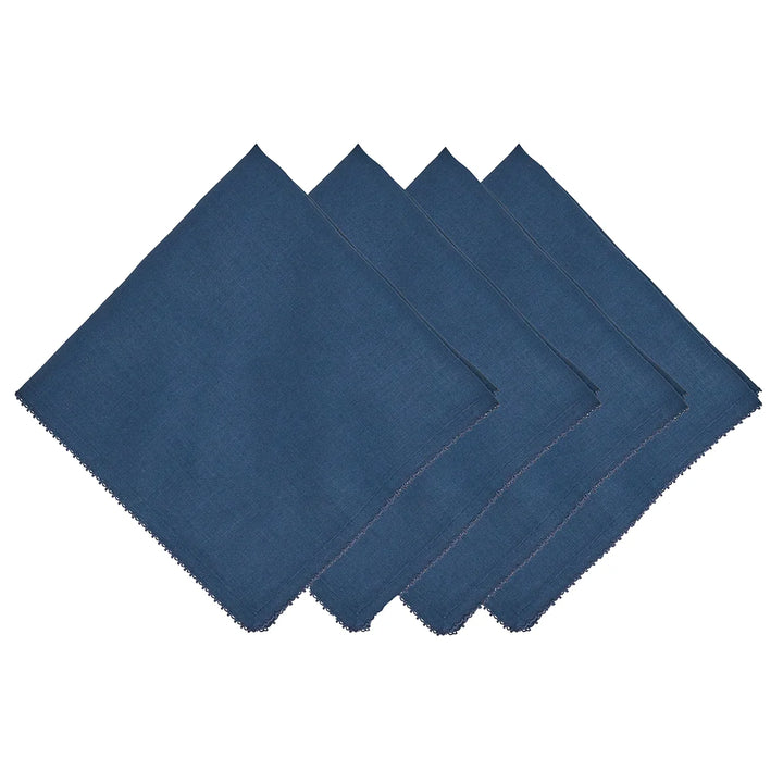 Set of four navy blue linen napkins featuring delicate tonal crochet edging and a classic woven texture