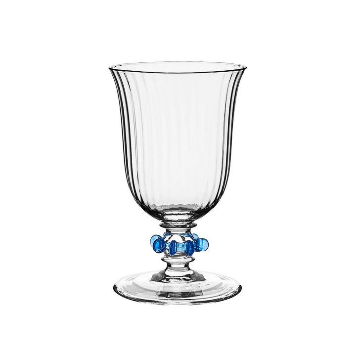 Nell Ruffle Goblet in Chambray featuring clear ribbed glass with decorative blue glass ruffle accents around the stem.