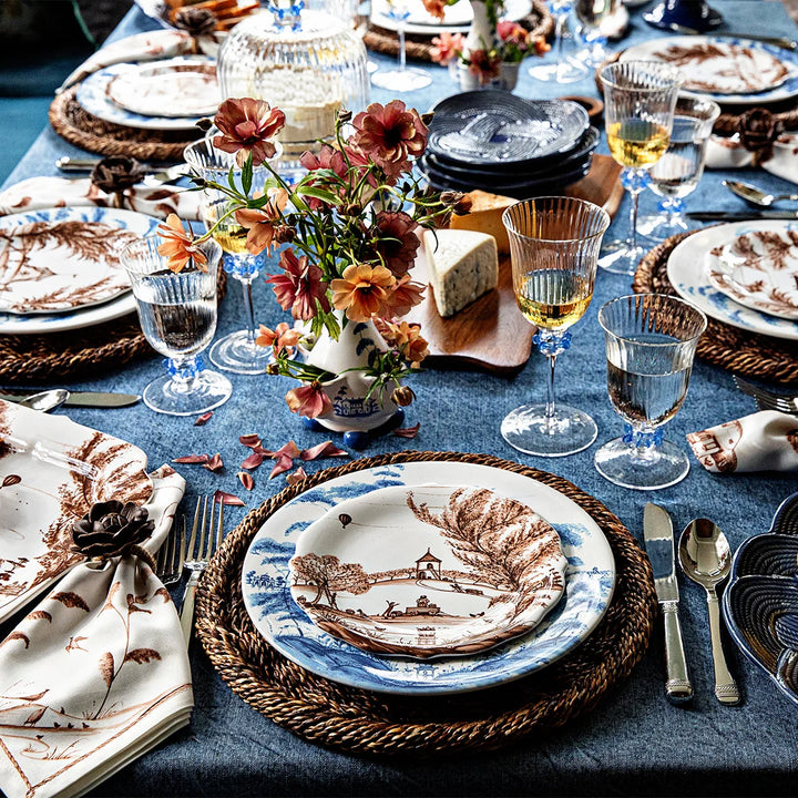 Nell Ruffle Goblet in Chambray displayed with coordinating glassware in an elegant tablescape featuring blue accents.