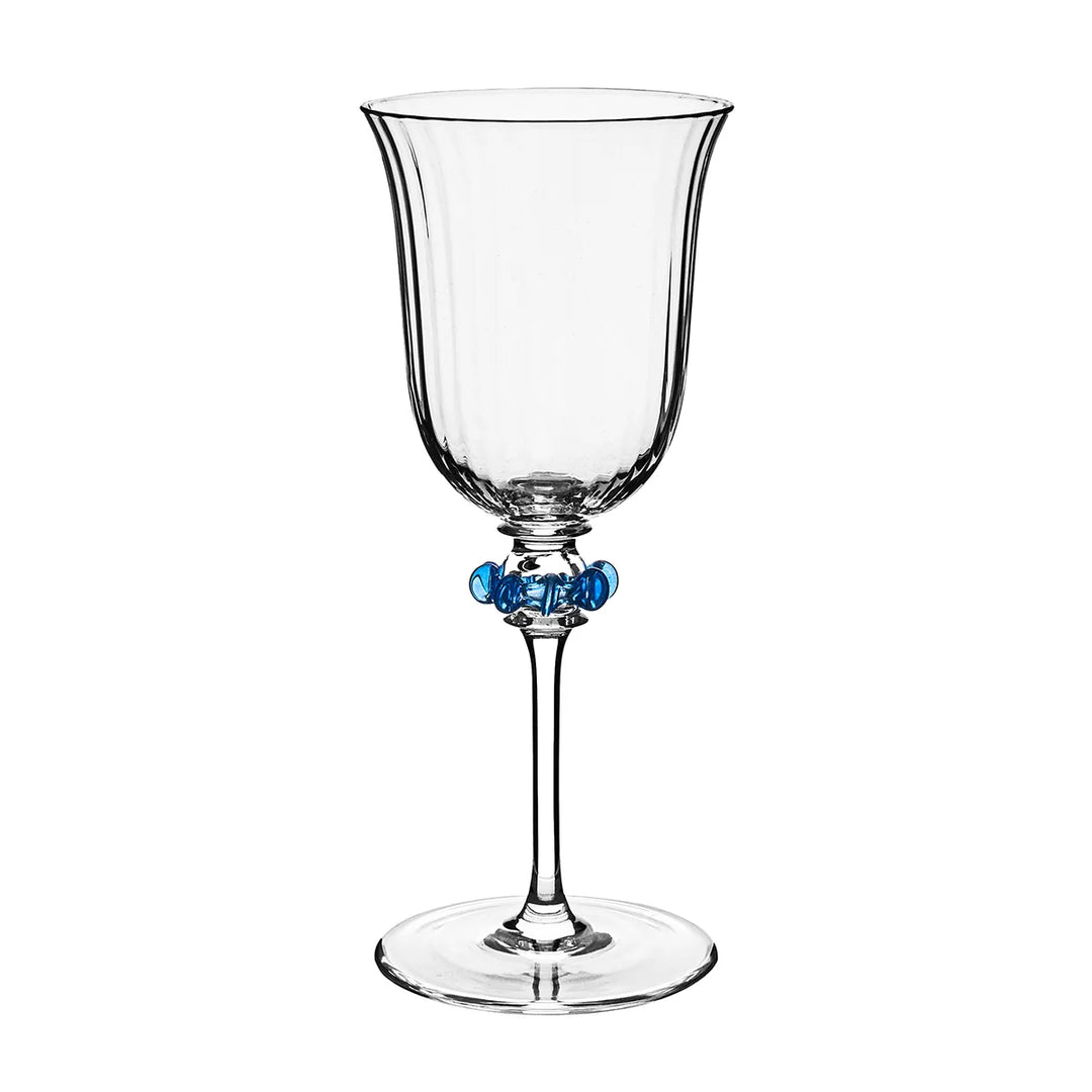 Nell Ruffle Wine Glass in Chambray featuring a clear ribbed glass bowl with decorative chambray blue ruffle accents around the stem.