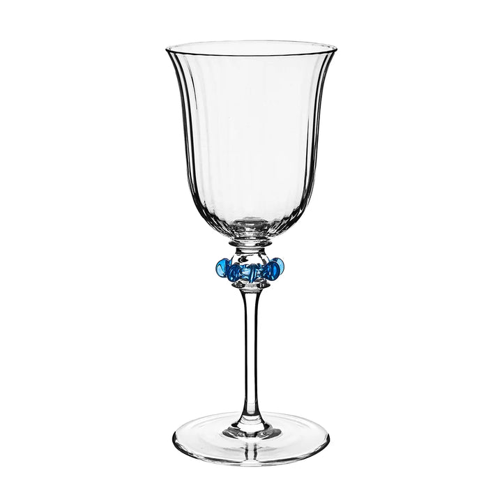 Nell Ruffle Wine Glass in Chambray featuring a clear ribbed glass bowl with decorative chambray blue ruffle accents around the stem.