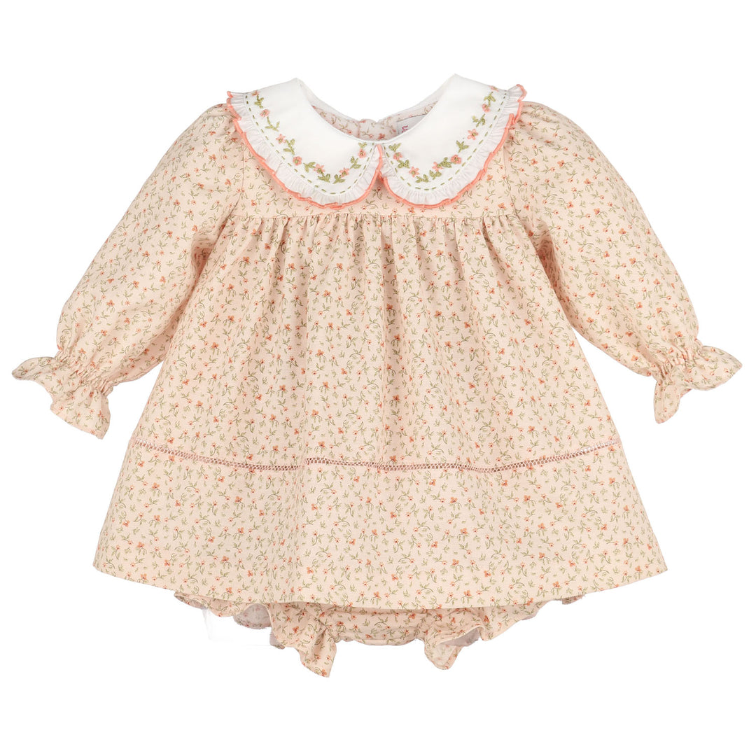 Front view of Orange Pumpkin Patch Playdate Float featuring a delicate orange floral print, embroidered white collar, ruffled long sleeves, and matching bloomer.