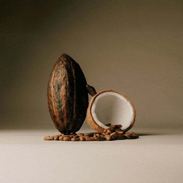 Organic cacao pod and coconut featured in The Conscious Bar Toasted Coconut Flakes dark chocolate