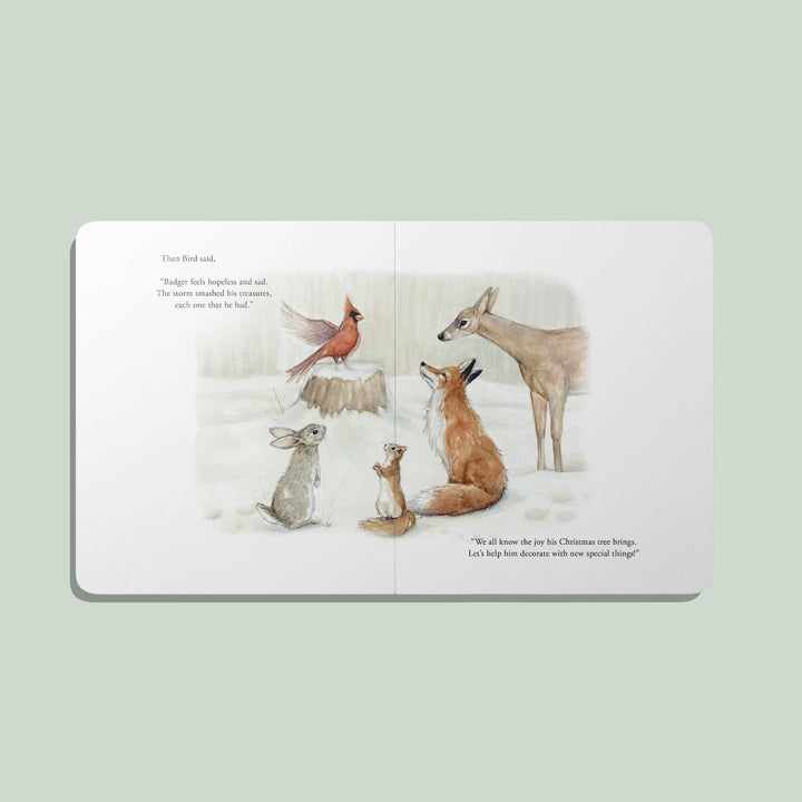 Interior spread from Our Little Adventure at Christmas featuring watercolor woodland animals in a snowy forest